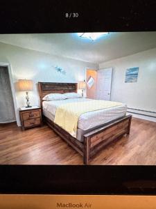 a bedroom with a bed and a table with a lamp at North Central Atlantic City in Atlantic City