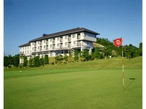 a building on top of a hill with a golf green at Utsunomiya Inter Resort Hotel - Vacation STAY 68874v in Utsunomiya