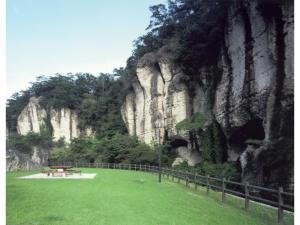a park with a bench in front of a mountain at Utsunomiya Inter Resort Hotel - Vacation STAY 68891v in Utsunomiya