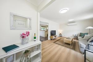 a living room with a couch and a table at Bellbird Willow Hunter Escape by Nature & Winery in Bellbird +27 photos