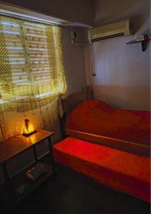 En eller flere senge i et værelse på Casa Inspira