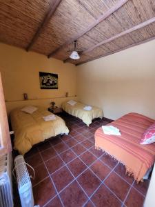 Ένα ή περισσότερα κρεβάτια σε δωμάτιο στο Ñawpa Wasi