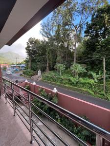 a view of a road from a balcony at Agape Suites-Room 4- 1st Floor in Soufrière