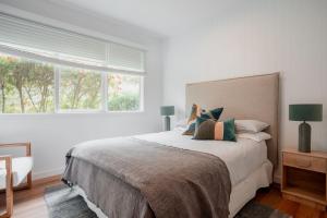 En eller flere senge i et værelse på Beachcomber Shoreham