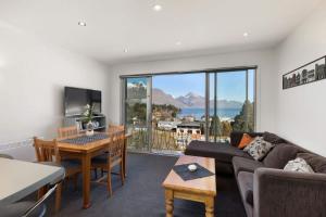 a living room with a couch and a table at Ballarat Bungalow in Queenstown