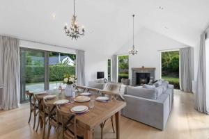 a living room with a table and a couch at Glebe Arrowtown in Arrowtown