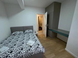 Кровать или кровати в номере A&A Sarajevo