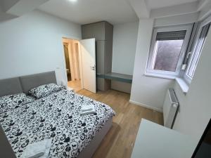 Кровать или кровати в номере A&A Sarajevo