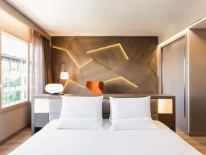 Postel nebo postele na pokoji v ubytování Novotel Campo De Las Naciones + 204 fotografií