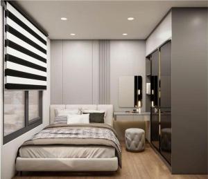 Asahi Luxstay - Benhill Apartment Binh Duong في Thuan An: غرفة نوم بها سرير وكرسي