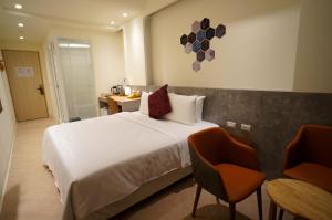 Ένα ή περισσότερα κρεβάτια σε δωμάτιο στο 向陽海 Sun&Sea INN