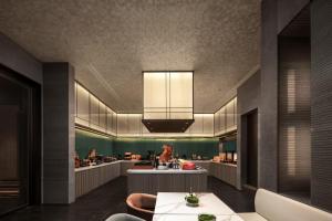 a dining room with a table and a kitchen at Atour Hotel Shanghai Songjiang G60 Dongjing in Shanghai