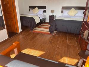 Postel nebo postele na pokoji v ubytování Cusco and Rock