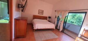 Postel nebo postele na pokoji v ubytování Posada Sarita