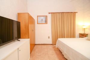 TV a/nebo společenská místnost v ubytování Casa con pileta Colastine III - Santa Fe