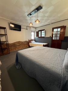 Ένα ή περισσότερα κρεβάτια σε δωμάτιο στο PyM