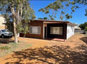 a house with a car parked in front of it at Central on Smith in Kalbarri