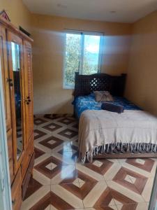 En eller flere senge i et værelse på Suite encantadora con vista al Rio