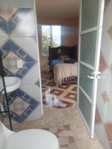 En eller flere senge i et værelse på Suite encantadora con vista al Rio