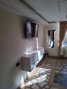 Un televizor și/sau centru de divertisment la Hotel Las Lajas Confort Ipiales