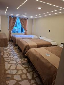 Un pat sau paturi într-o cameră la Hotel Las Lajas Confort Ipiales