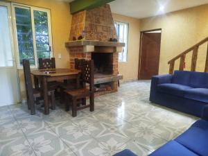 Et opholdsområde på Suite encantadora con vista al Rio