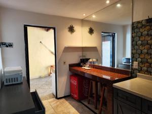 a kitchen with a counter and a counter top at Cancún Hotel Boutique & Hostel in Cancún