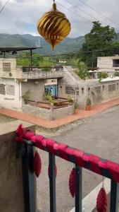 a view of a house from a balcony with a banana at Rosablanca RN in Guaduas