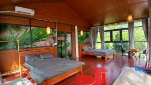 Postel nebo postele na pokoji v ubytování FB Farmstay - Vườn An Lành Bên Suối + 45 fotografií
