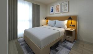 En eller flere senge i et værelse på Home2 Suites By Hilton Dublin City Centre