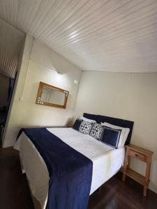 Postel nebo postele na pokoji v ubytování Pousada Dom Luiz + 1 fotografie