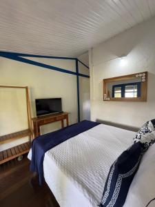 Postel nebo postele na pokoji v ubytování Pousada Dom Luiz