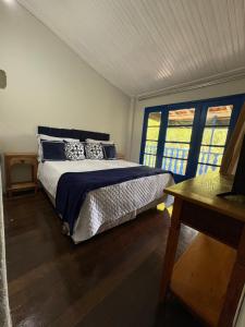 Postel nebo postele na pokoji v ubytování Pousada Dom Luiz