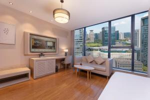 Postel nebo postele na pokoji v ubytování Crystal Orange Hotel (Hangzhou Binjiang Star Avenue) + 22 fotografií