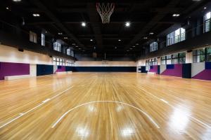 an empty gymnasium with a wooden basketball court at Atour Hotel Shanghai City Center ATHOUSE嘉邸 in Shanghai