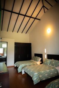 Кровать или кровати в номере Hotel Campestre Casa de la Abuela