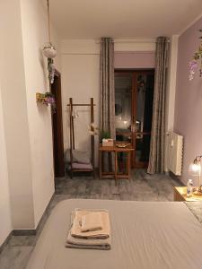 Un pat sau paturi într-o cameră la Le Stanze di Bimba