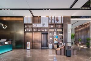 a lobby of a building with a lobby at Atour Hotel Jiading Nanxiang in Jiading