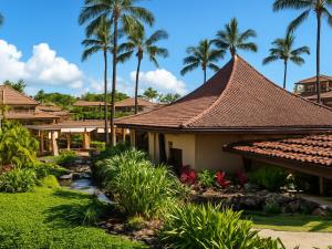 a house with a tile roof and palm trees at Sheraton Kauaʻi Resort Villas- STUDIO in Koloa