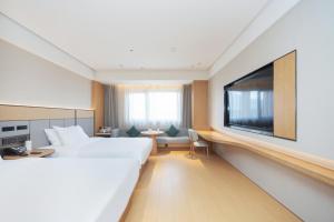 Et tv og/eller underholdning på JI Hotel Suzhou Amusement Park