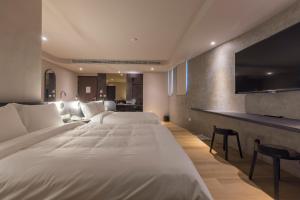 Postel nebo postele na pokoji v ubytování SUPERB HoTEL