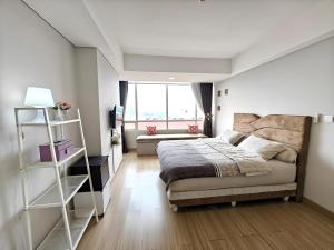 Ένα ή περισσότερα κρεβάτια σε δωμάτιο στο Stylish 3BR Skandinavia Tangcity Apt Max 12 Guests +36 φωτογραφίες