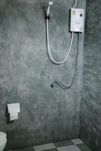 a bathroom with a shower with a toilet at Khao Sok Green Mountain View in Khao Sok National Park +122 photos