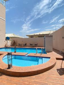 a large swimming pool on top of a building at Glovis Suites in Abuja