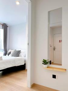 Ένα ή περισσότερα κρεβάτια σε δωμάτιο στο Komfy Quarters