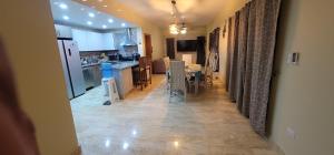 a kitchen and dining room with a table and chairs at Luxury Cabarete East Condominiums in Cabarete +10 photos
