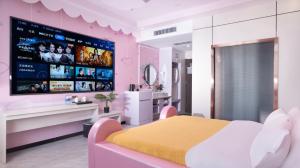 Un televizor și/sau centru de divertisment la 万信至格酒店库车天山中路店