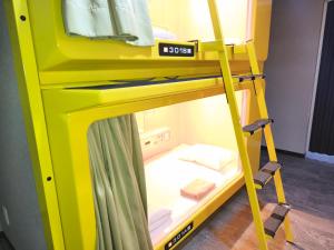 Postel nebo postele na pokoji v ubytování Hotel Shin-Imamiya