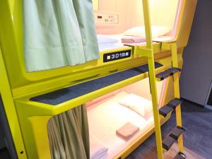 Postel nebo postele na pokoji v ubytování Hotel Shin-Imamiya