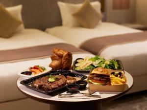 a tray of food on a table in a hotel room at Villa Fontaine Grand Tokyo Roppongi in Tokyo